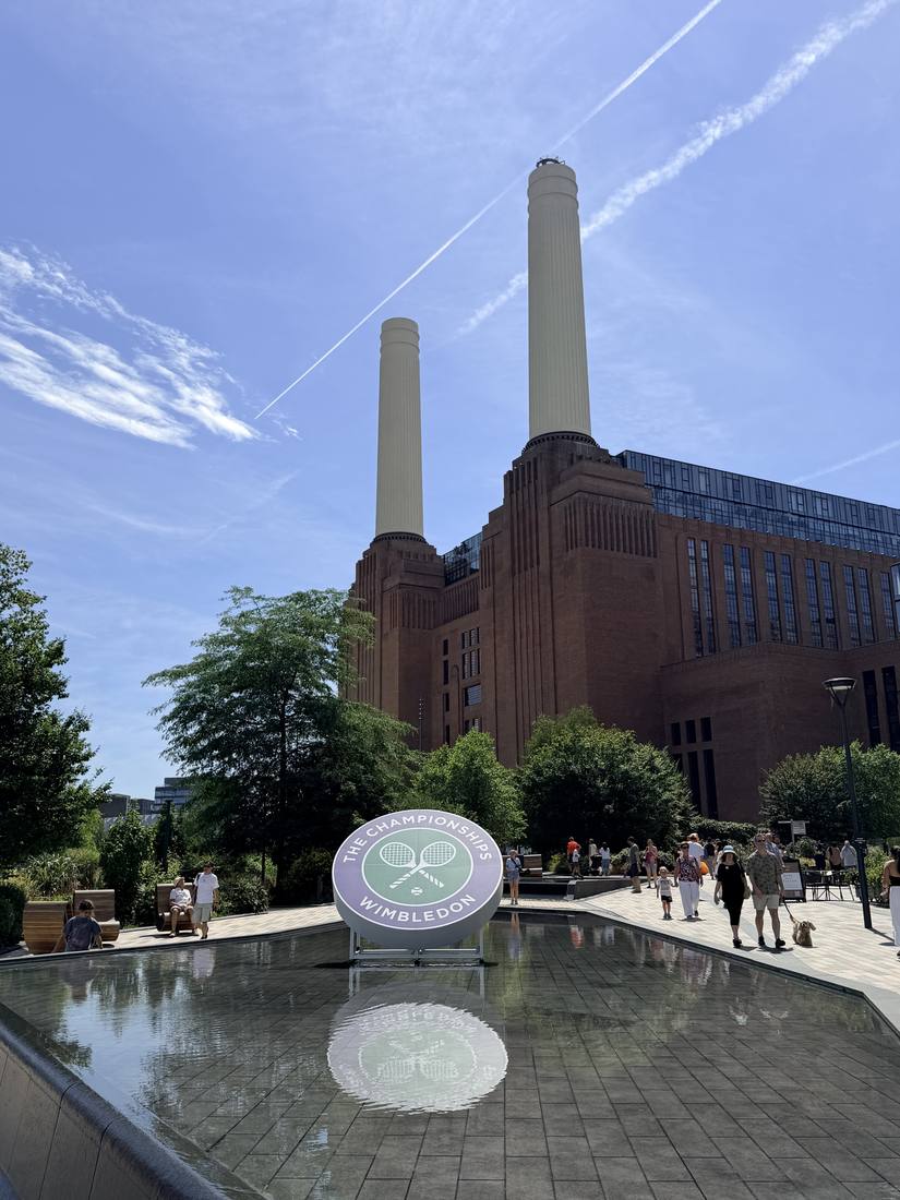 Battersea Power Station's chimneys above a water feature